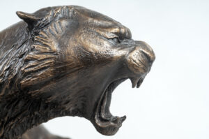 Profile of Matt Weir's miniature bronze tiger for St. X High School.
