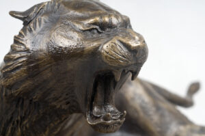 Bronze model of Matt Weir's miniature bronze tiger for St. X High School.